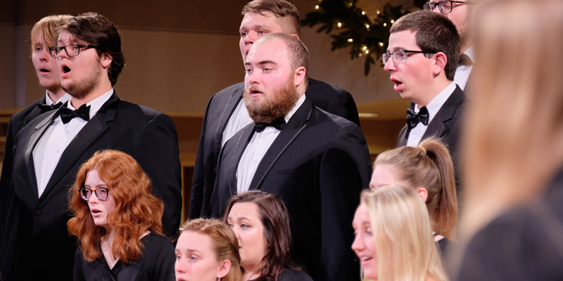 Choir members singing