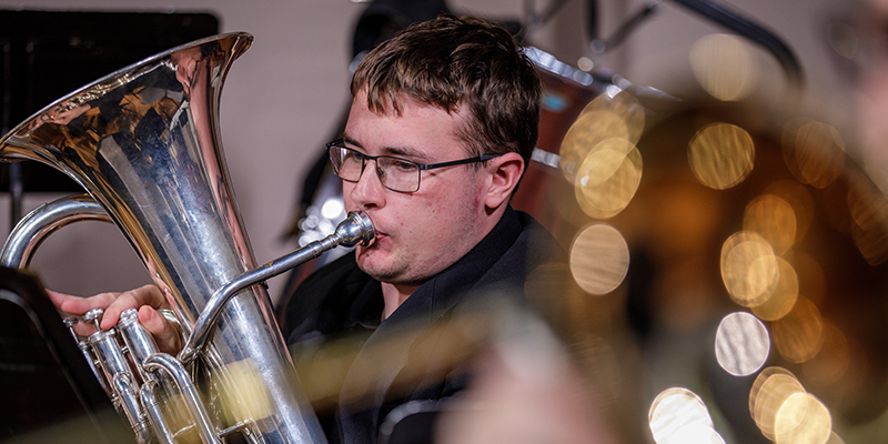 Student playing euphonium during band concert