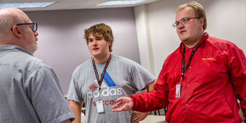 Northwestern NEXT students talking with a professor