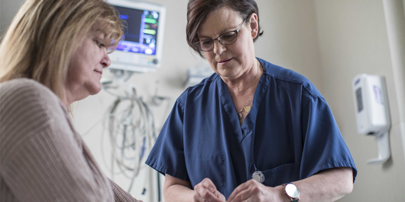 Nursing working with a patient