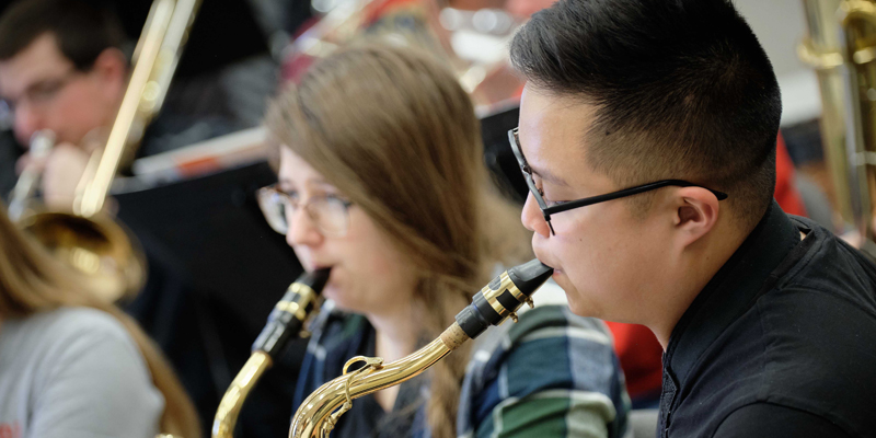 Student playing a saxophone