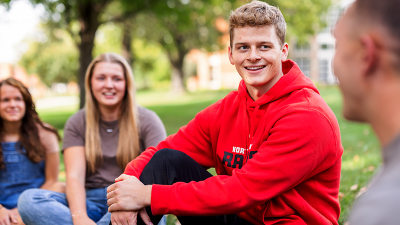 Students hanging out on the campus green