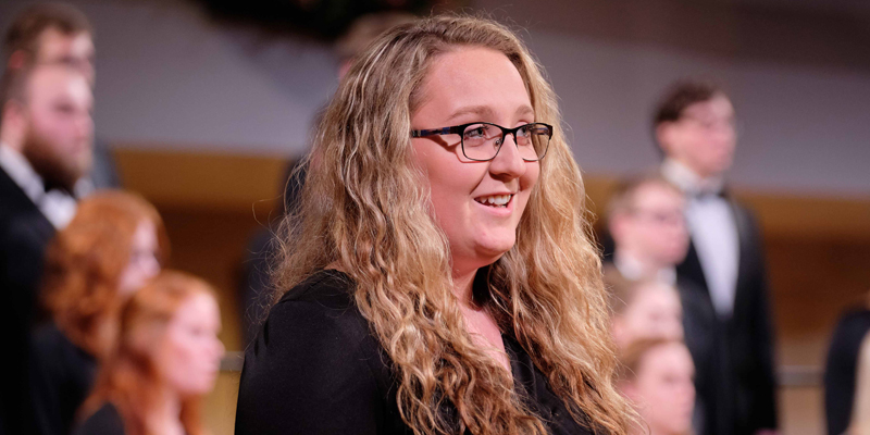 Student singing during Christmas Vespers
