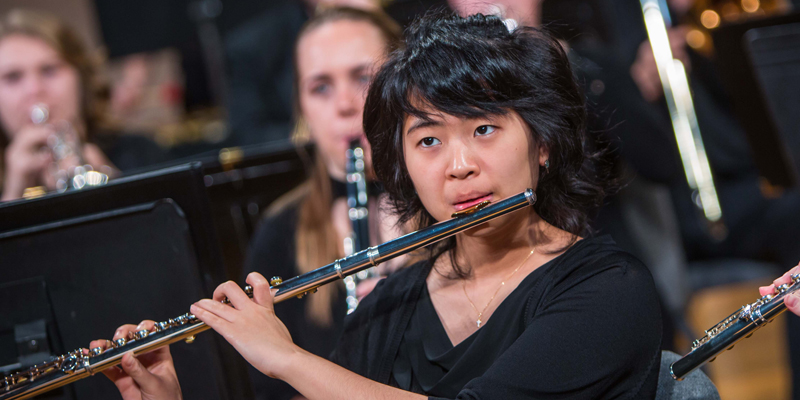 Symphonic band member playing the flute