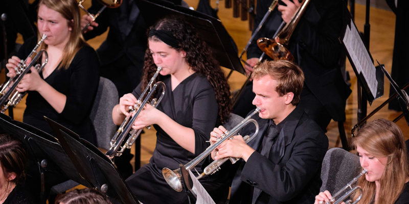 Students playing the trumpet