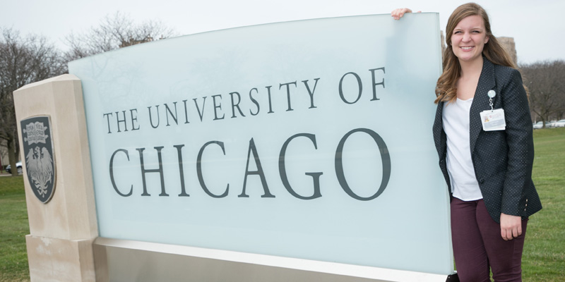 Alison Schutt by University of Chicago sign