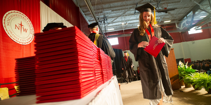 Student receiving her diploma at commencement