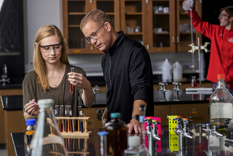 Northwestern students and professor in chemistry lab